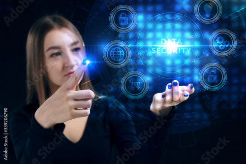 Business, Technology, Internet and network concept. Young businessman working on a virtual screen of the future and sees the inscription: Data security