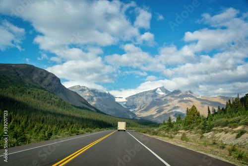 Driving on the Icefields Parkway between Banff and Jasper in the Canadian Rockies, Alberta, Canada © Delphotostock
