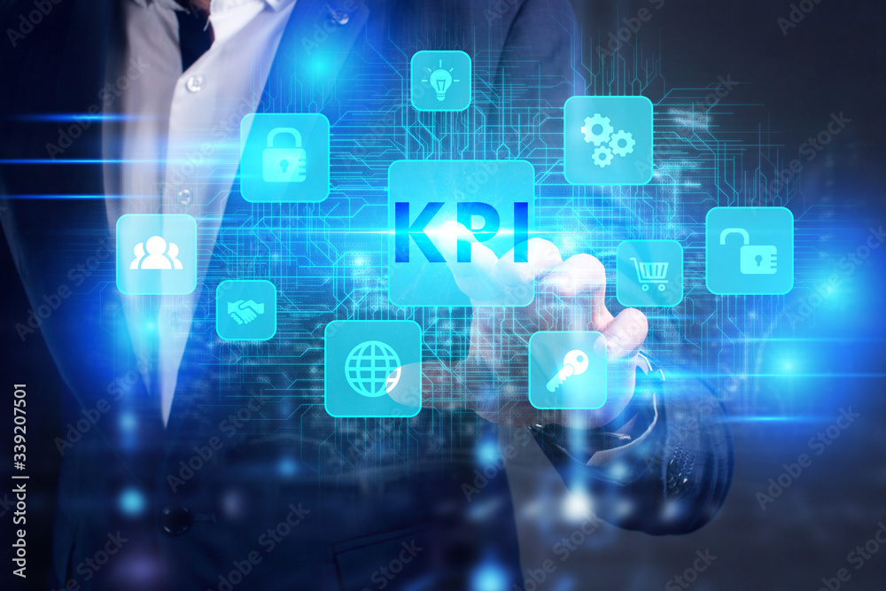 Business, Technology, Internet and network concept. Young businessman working on a virtual screen of the future and sees the inscription: KPI Business, Technology, Internet and network concept. Young businessman working on a virtual screen of the future and sees the inscription: KPI