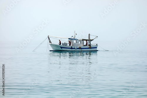 Shrimp boat in the Mediterranean, in front of the coast of Malaga. Picking the typical 