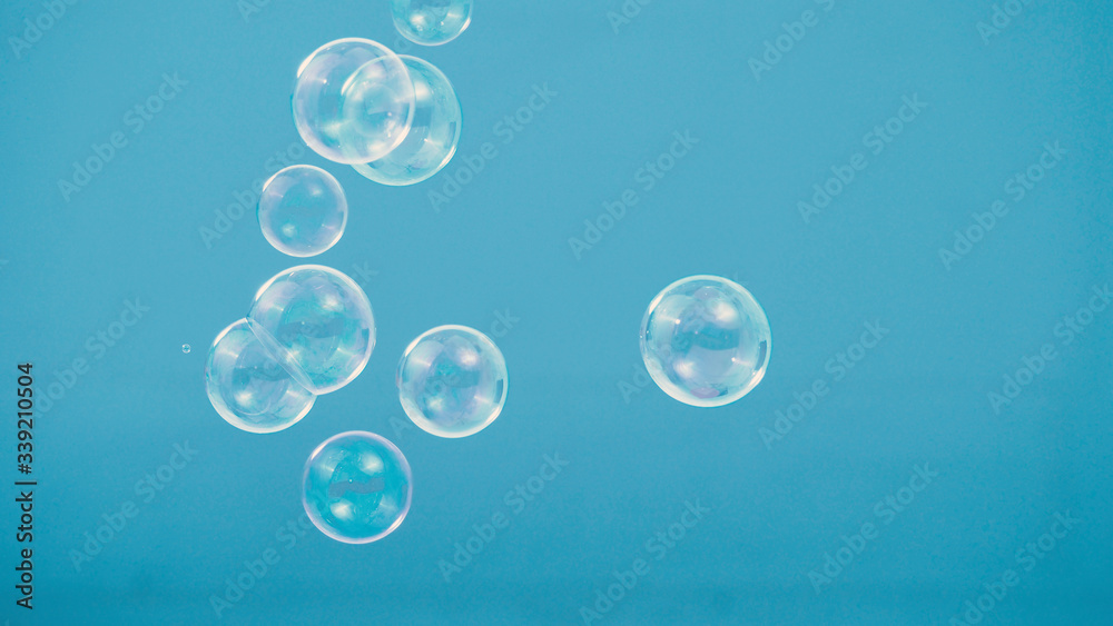 Shampoo bubbles floating like flying in the air by wind blow which represent refreshing playful or joyful moments and gentle soft comfortable and look wet and soapy for hygiene detergent product indus