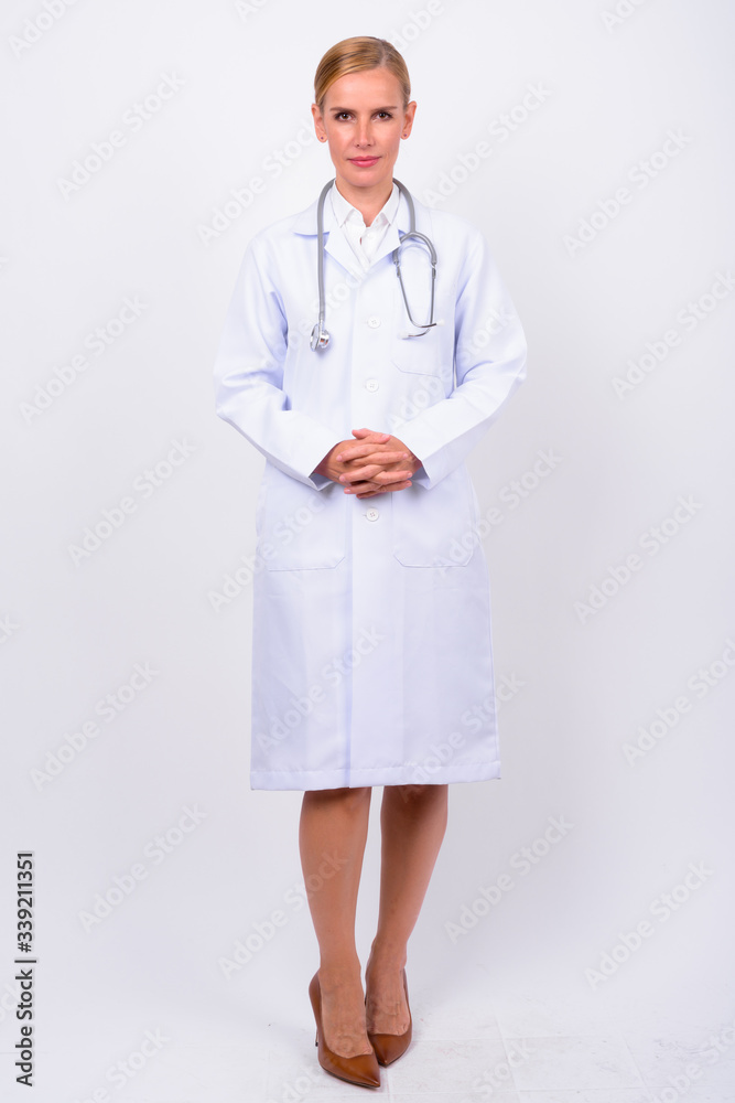 Full body shot of blonde woman doctor