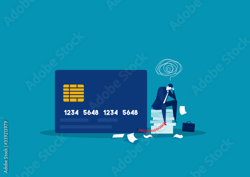 Canvas Print businessman stress debt  with foot chained to bank credit card trying to escape