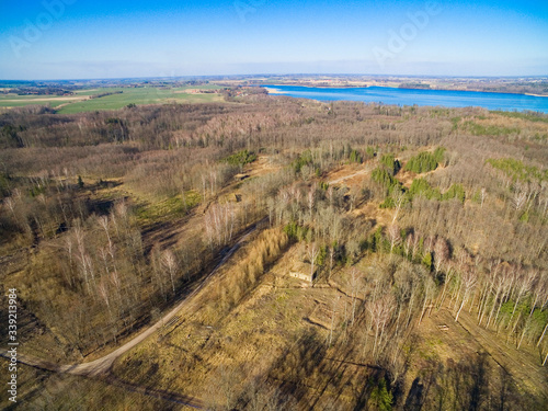 Aerial view of reinforced concrete bunkers belonged to Headquarters of German Land Forces from ww2 hidden in a forest in spring season in Mamerki, Poland (former Mauerwald, East Prussia)