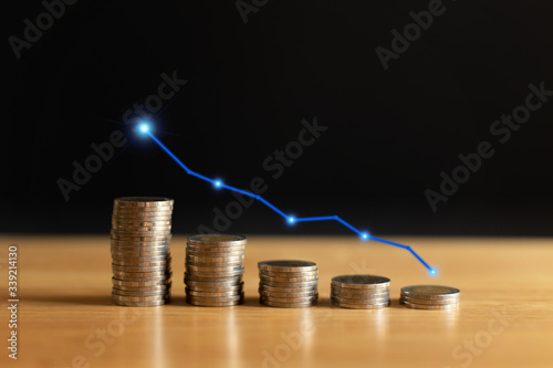 Growing stack of coins with a graph of profit. Concept for property, ladder ,real estate investment and saving