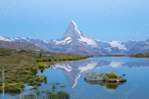 Sunrise view on iconic mountain Matterhorn and Stellisee lake in Valais region  Switzerland  Europe