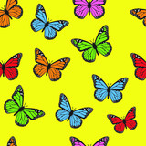 Seamless pattern of monarch butterflies in red blue orange and pink color
