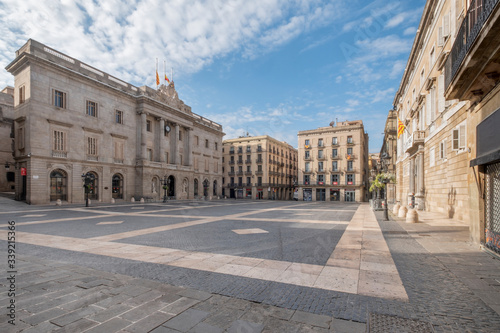 Barcelona, Catalonia / Spain: 04 09 2020: Sant Jaume square with Generalitat palace and city hall, empty streets in the city of Barcelona during the covid-19 coronavirus pandemic