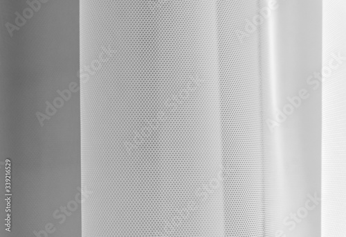 White tulle fabric abstract background,white tulle background,selective focus