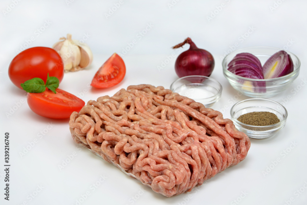 cooking ingredients minced ground meat and vegetables in the kitchen on a white background  