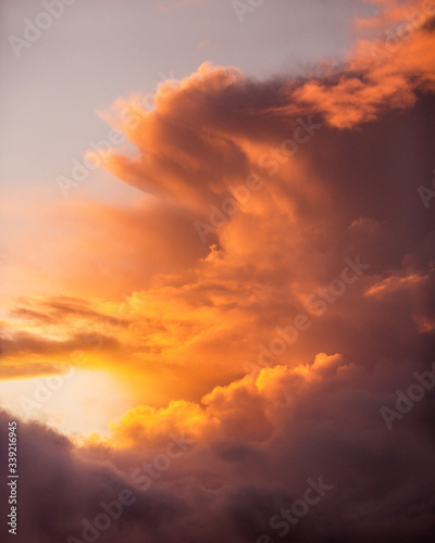 Beautiful Colorful Orange  Yellow and Pink Sunset Burning through the clouds in the sky