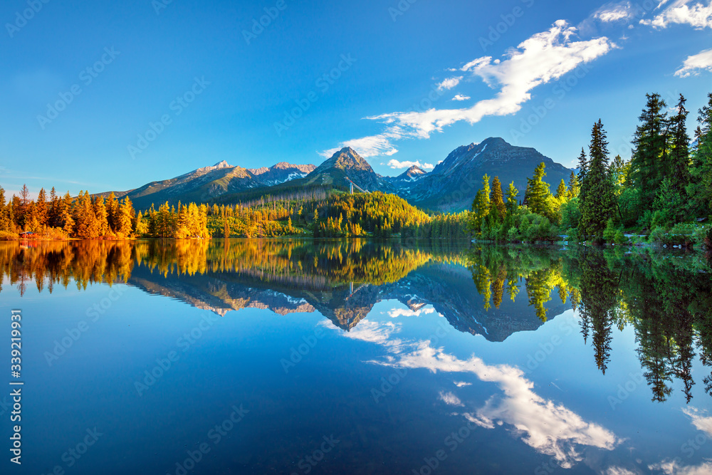 Fototapeta premium Summer scenic view on High Tatras mountains - National park and Strbske pleso (Strbske lake) mountain lake in Slovakia