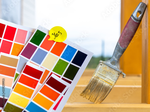 The Builder carries the boards. A man in an orange vest, constru