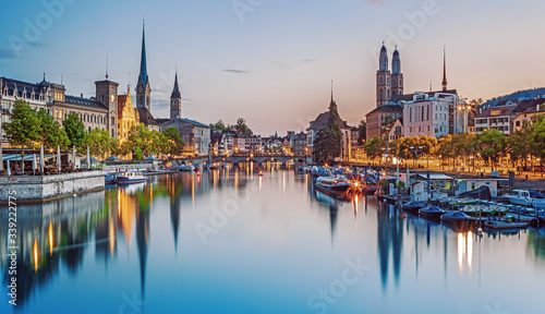 Scenic view of historic Zurich city center with famous Fraumunster and Grossmunster Churches and river Limmat at Lake Zurich, Zurich, Switzerland 