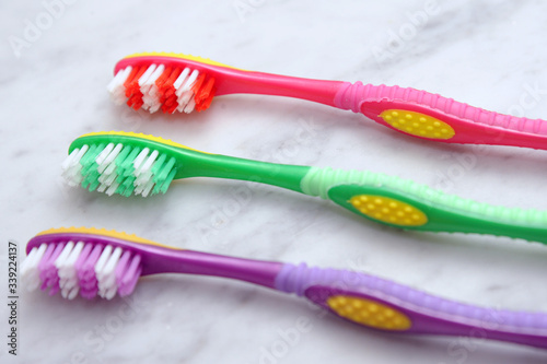 toothbrush red green and violet - toothbrushes of various colors for oral hygiene  dentist and caries prevention dental cleaning