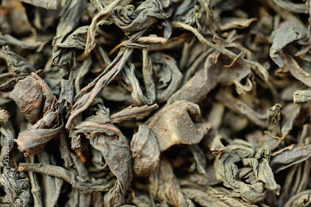 Dried tea leaf, close-up. Background image of the texture. Dried tea leaf, close-up. Background image of the texture.