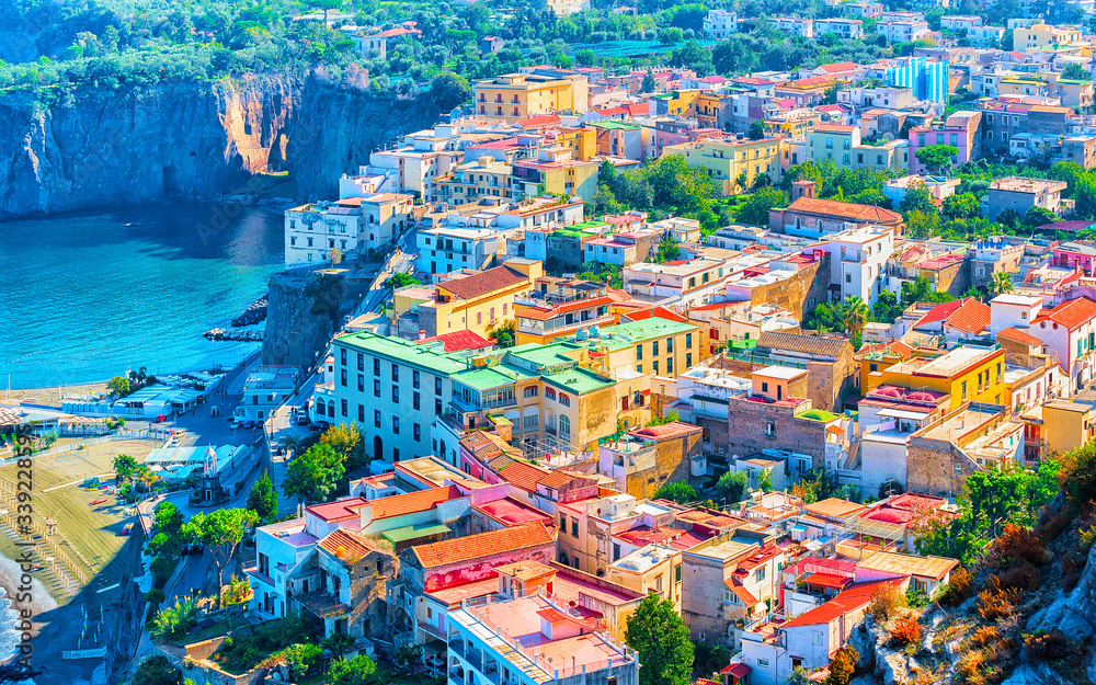 Cityscape of Marina Grande with houses and port at Sorrento reflex