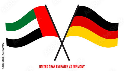 United Arab Emirates and Germany Flags Crossed And Waving Flat Style. Official Proportion