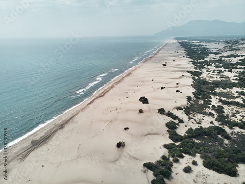 Aerial top view of long sandy beach of Patara, Antalya. Drone perspective turkise water with sand dunes turkey photo