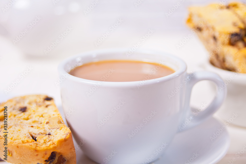 Italian biscotti and cup of coffee with milk. Close up. Italian biscotti and cup of coffee with milk. Close up.
