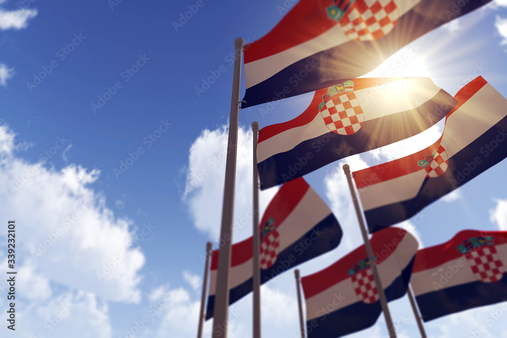 Croatia flags waving in the wind against a blue sky. 3D Rendering