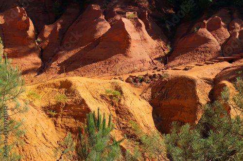 The nice yellow and red sandstone rocks by Roussillon in France. The nice natural sight and tourist attraction. 