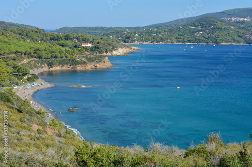 Aerial view of Norsi beach and Capoliveri hilltop town, on Elba Island. Tuscany, Italy