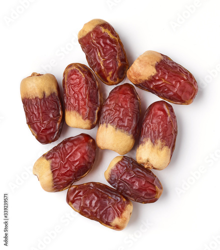 Heap of dates isolated on white, from above