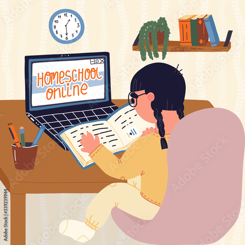 Little girl pupil of elementary school doing homework online at home by learning online because of Covid-19 self-isolation. Corona virus quarantine, online education and home school learning concept.