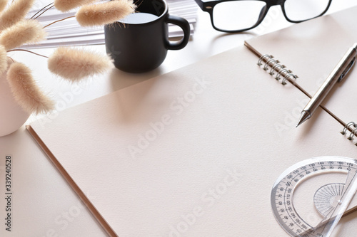 Close-up view, Free space on a book for simple designs or other work with book, pencil, ruler and coffee mug is elements.