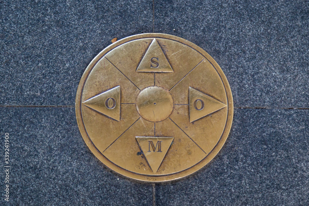 Fototapeta premium Iron cardinal points on the ground