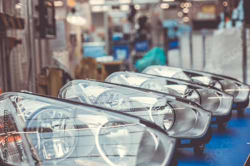 Close up of car headlamps, headlights in a row ready for assembly to the car, automotive industry concept photo