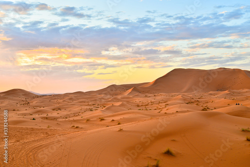 Beautiful sunset over Sahara desert sand dunes in Morocco, Africa