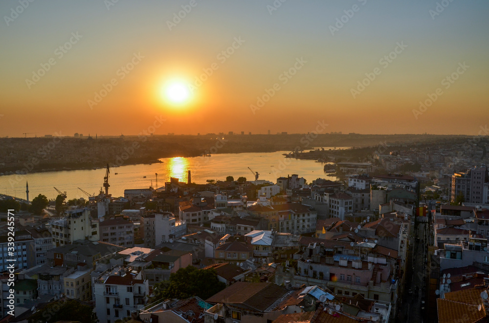 View of Istanbul and Golden Horn from the observation deck of the Galata tower. Panoramic view from above at sunset