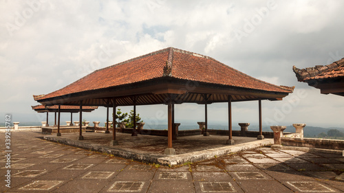 Red roofs of an abandoned hotel in Bali. Beautiful landscape.