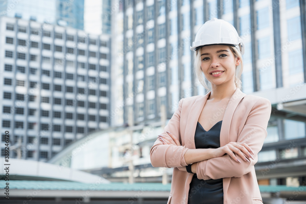 Portrait of pretty young civil engineer woman on construction building background. Evolution construction concept. Portrait of pretty young civil engineer woman on construction building background. Evolution construction concept.