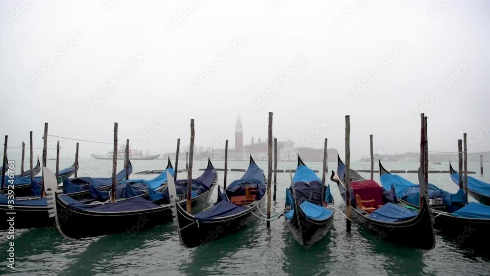 View of San Giorgio Maggiore in the mist from the gondolas at San Marco Square, Venice View of San Giorgio Maggiore in the mist from the gondolas at San Marco Square, Venice