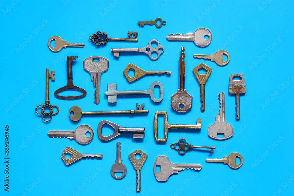 Obraz premium keys on a blue background, top view.