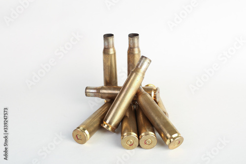 Photo rifle bullet shell casings on white background