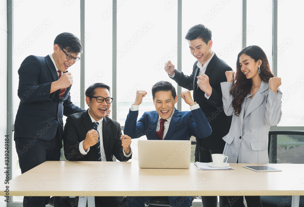 Asian business people celebrate in office. Happy moment of business group finished the jobs. Asian business people celebrate in office. Happy moment of business group finished the jobs.