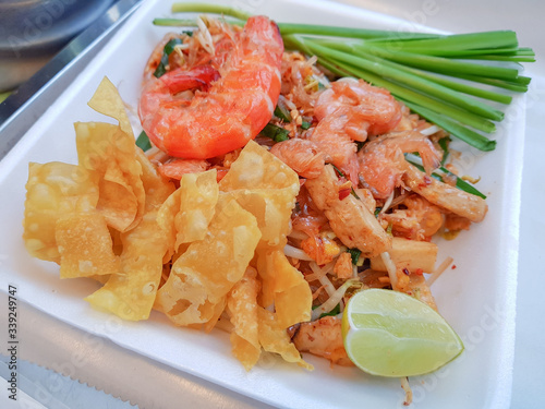 Famous Thai Steet Food : Pad Thai Koong, Stir Fry Noodles And Shrimp Mix With Suace. Selective Focus photo