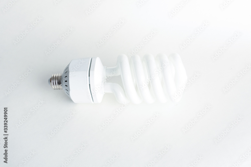 white energy saving lighbulb on white background white energy saving lighbulb on white background