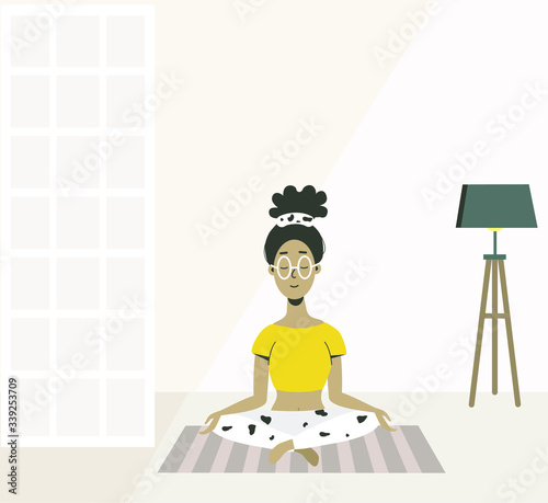 Woman with closed eyes doing asana yoga at home in the living room.