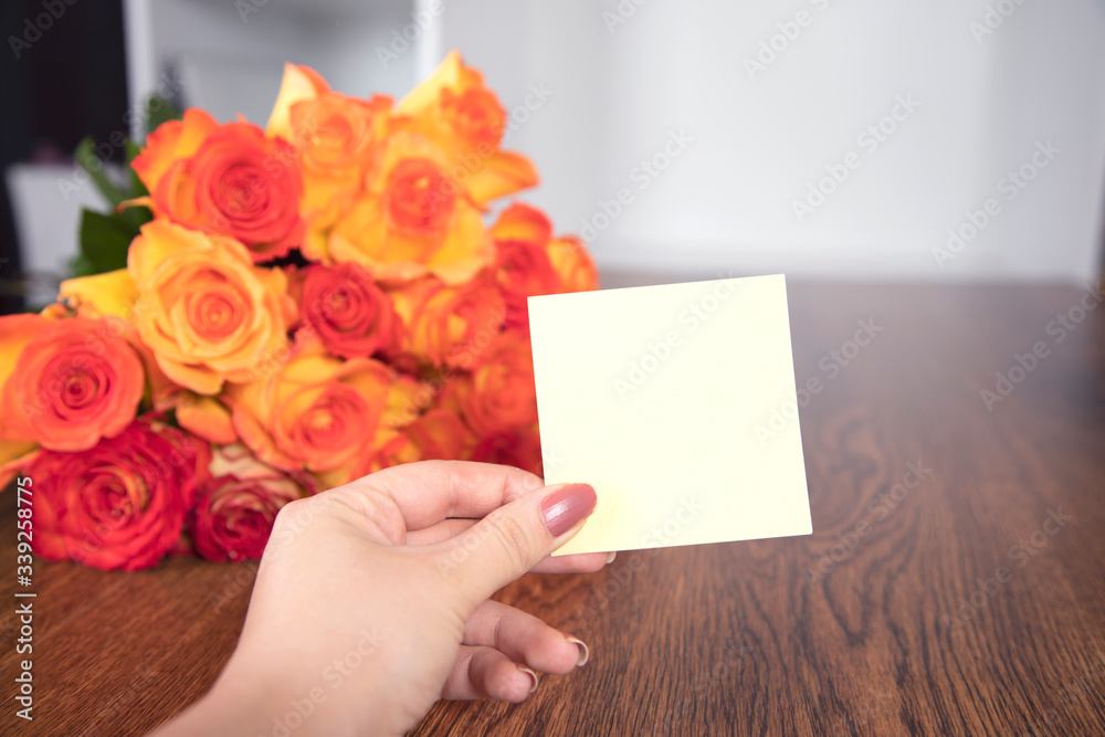 woman hand paper and roses woman hand paper and roses