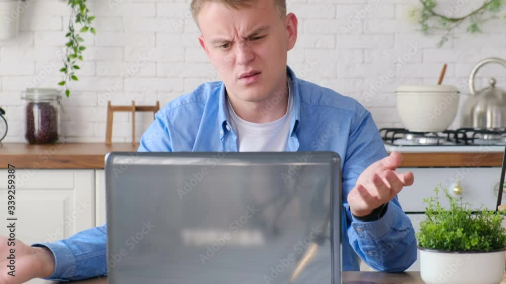 Frustrated man looking at a computer screen