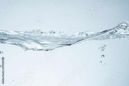 Water splash isolated. Close up of splash of water forming flower shape, isolated on white background.