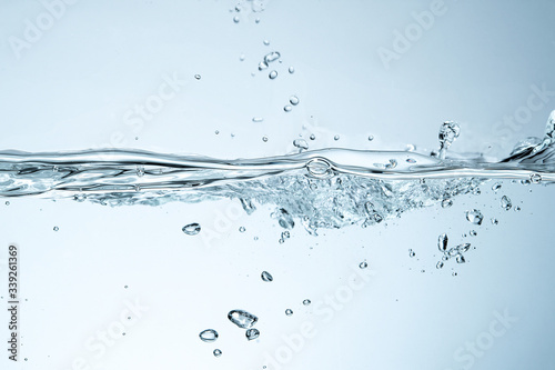 Water splash isolated. Close up of splash of water forming flower shape, isolated on white background.