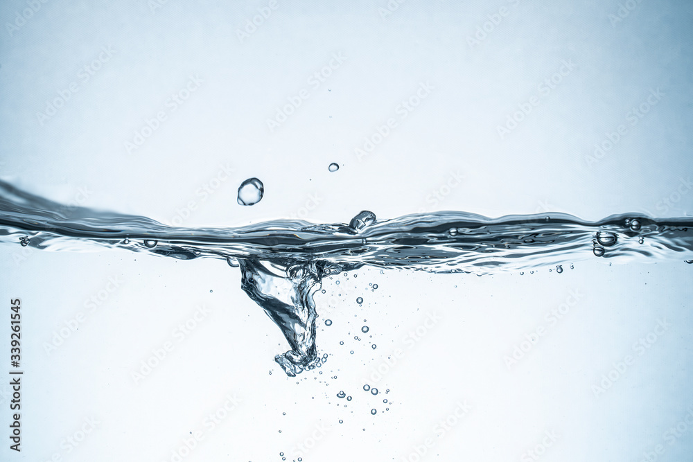 Water splash isolated. Close up of splash of water forming flower shape, isolated on white background. Water splash isolated. Close up of splash of water forming flower shape, isolated on white background.