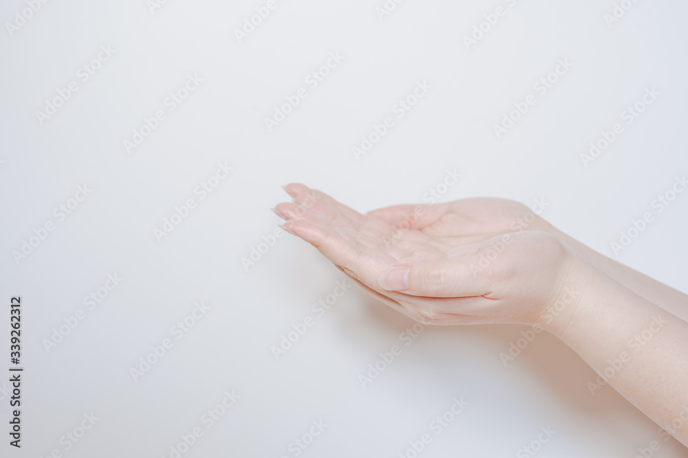 clean and protect COVID-19 virus activity from woman hand after clean by alcohal gel with white isolated background clean and protect COVID-19 virus activity from woman hand after clean by alcohal gel with white isolated background