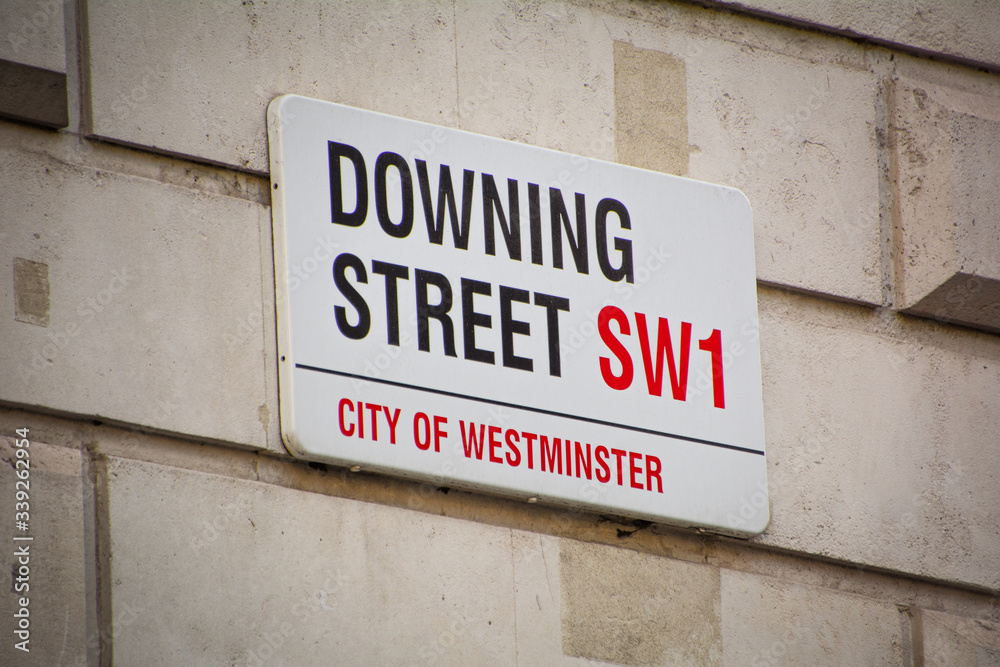 London- Downing Street street sign - location of 10 Downing Street, the headquarters of the British Government London- Downing Street street sign - location of 10 Downing Street, the headquarters of the British Government